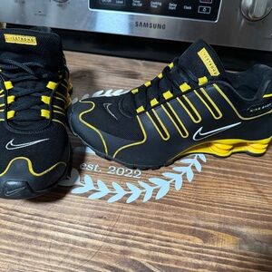 Mens Nike 11.5 black and yellow shoes